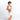 Woman wearing a Sherpani Skye Desert Shoulder Bag against white backdrop. #color_desert-pink