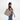 A woman wearing a Sherpani Jetsetter Dune Travel Tote Bag on white backdrop.  #color_dune-tan