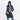 A woman wearing a Sherpani Jetsetter Raven Black Travel Tote Bag on white backdrop. #color_raven-black